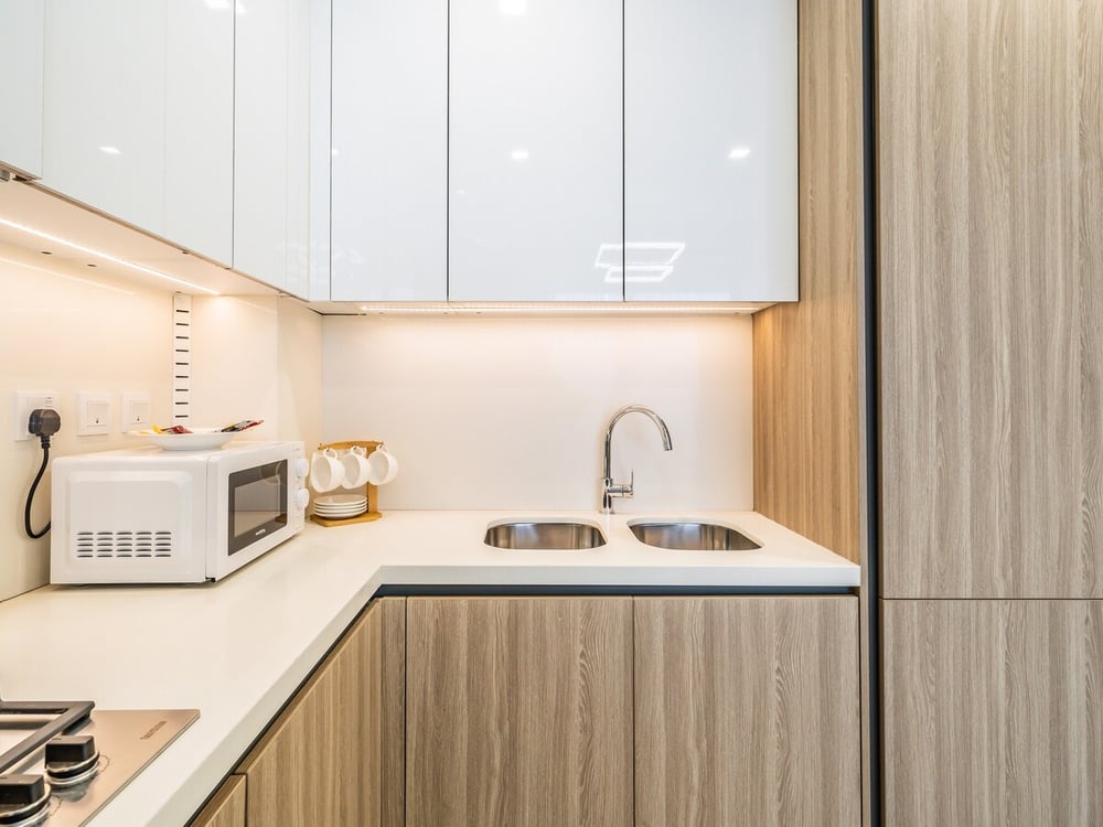 Kitchen with sink microwave toaster and kettle