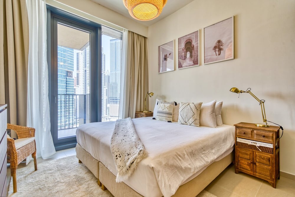 Bedroom with king bed, balcony access and wardrobe