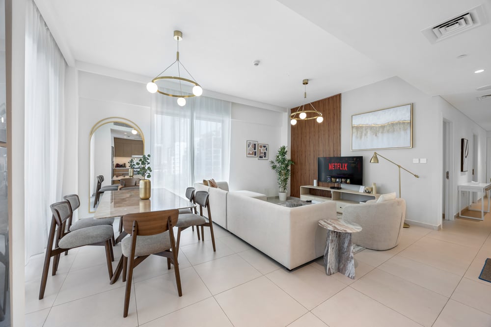 Living and dining area with TV and natural light