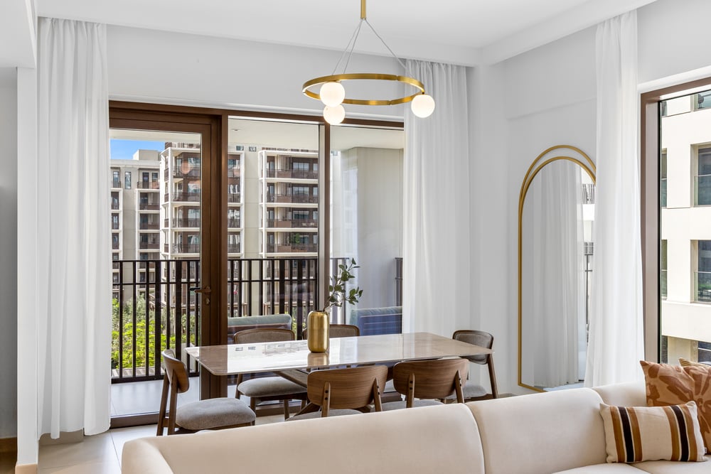 Dining area with balcony view and sofa seating
