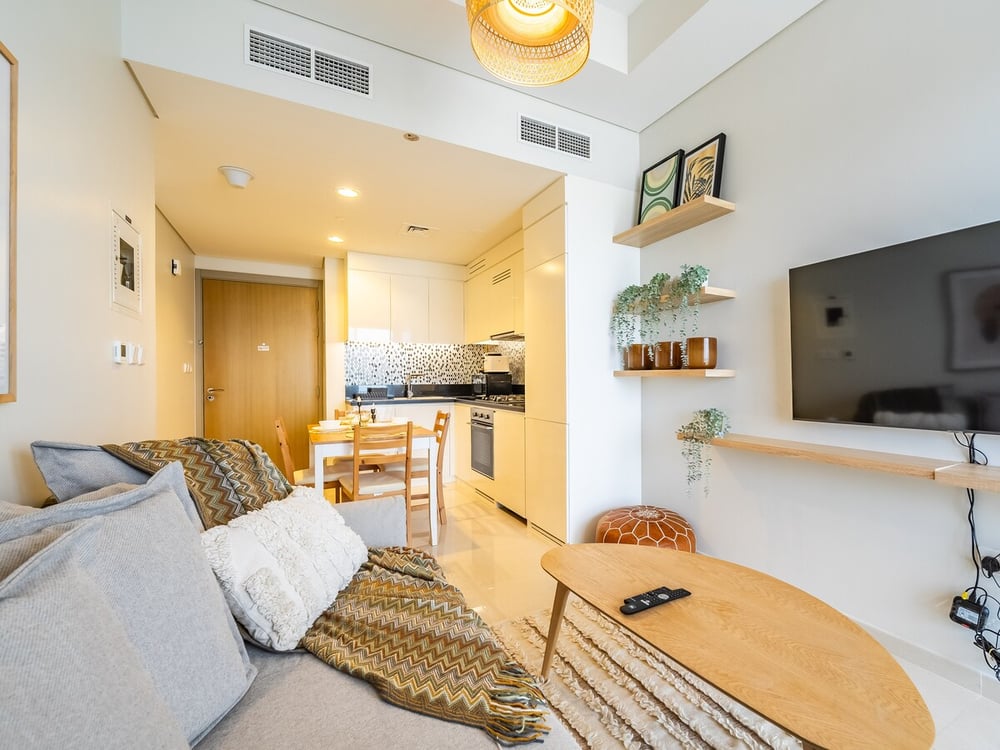Open-plan living room with kitchen and dining area visible