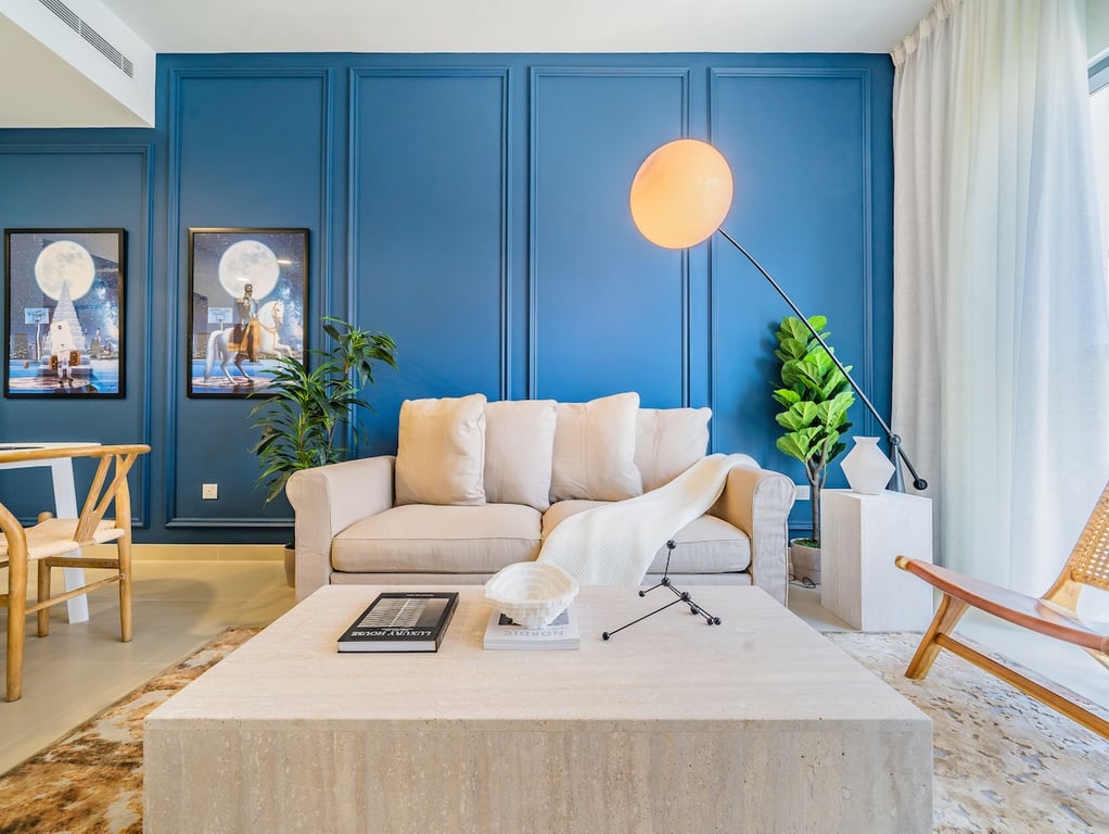 Living room blue panelled wall sofa and coffee table