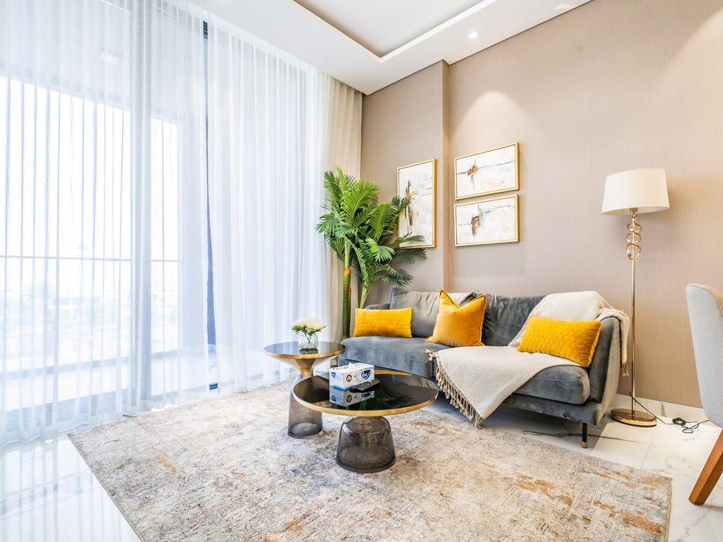 Living room with grey sofa and yellow cushions
