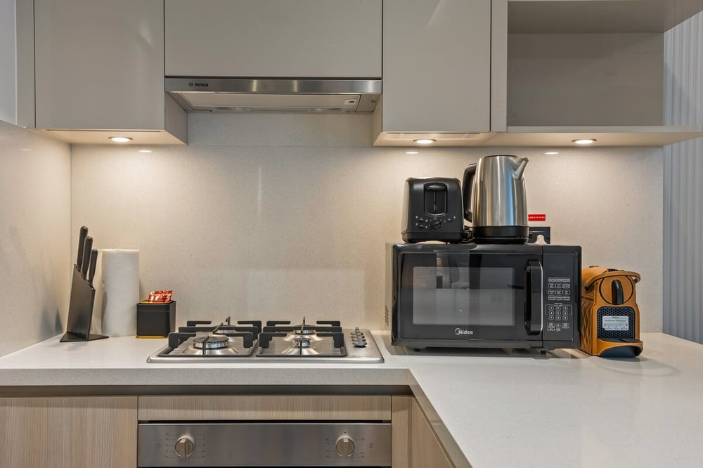 Kitchen counter with hob microwave and hood