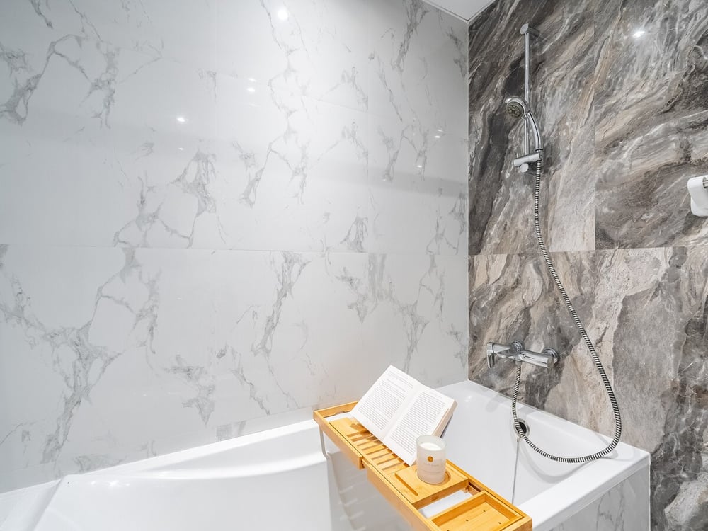 Marble bathroom with bathtub and shower
