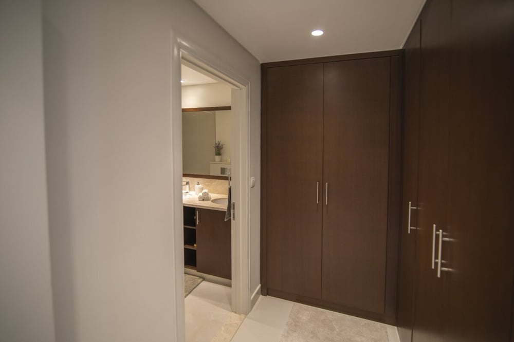 Bedroom hallway with large built-in wardrobe and en-suite bathroom