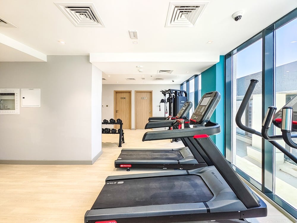 Building gym with treadmills and cardio equipment