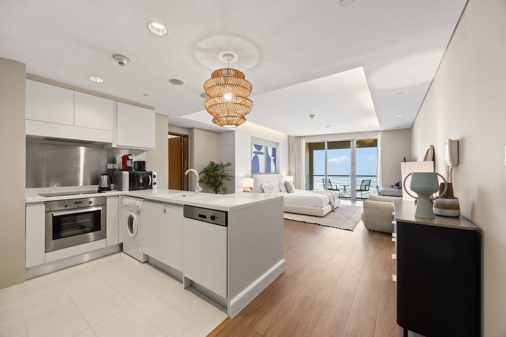 Open-plan kitchen and living area with island and city view