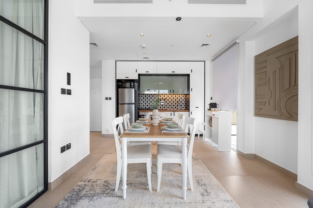 Open-plan living and dining area viewed from entry side