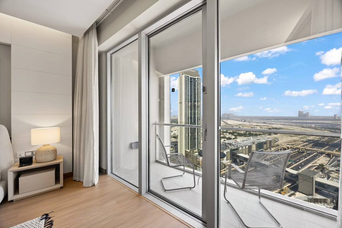 Balcony with city skyline view and glass sliding doors