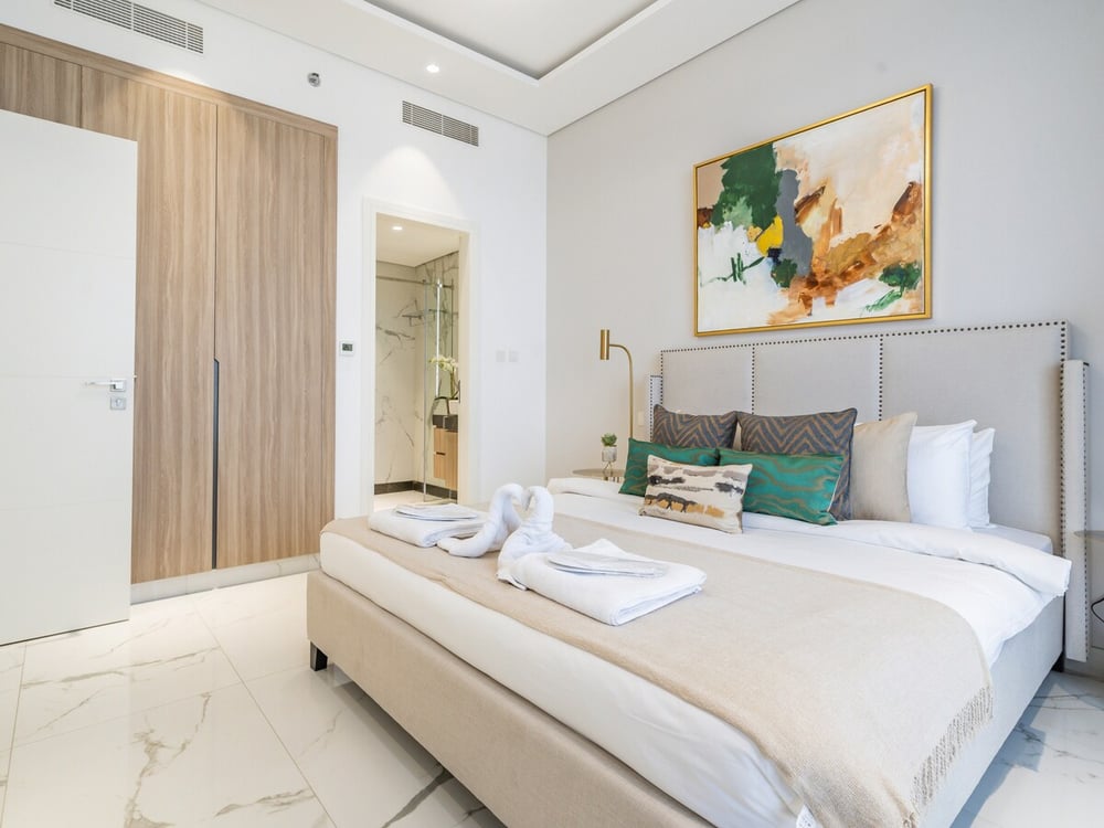 Bedroom with double bed wardrobe and en-suite door