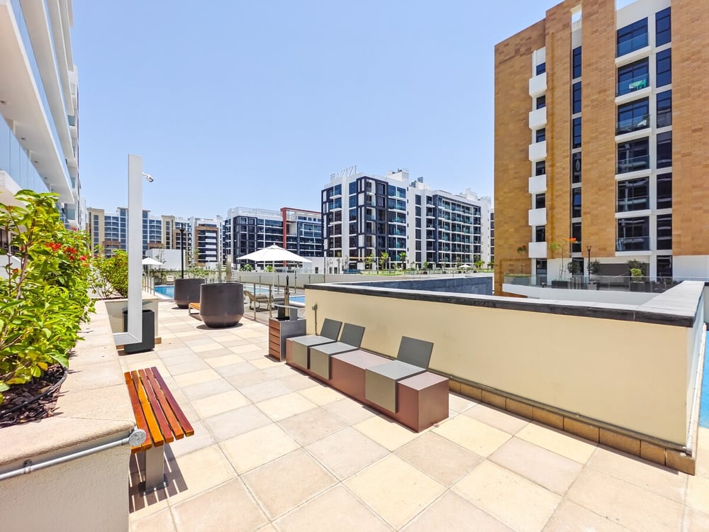 Rooftop terrace with benches and building views