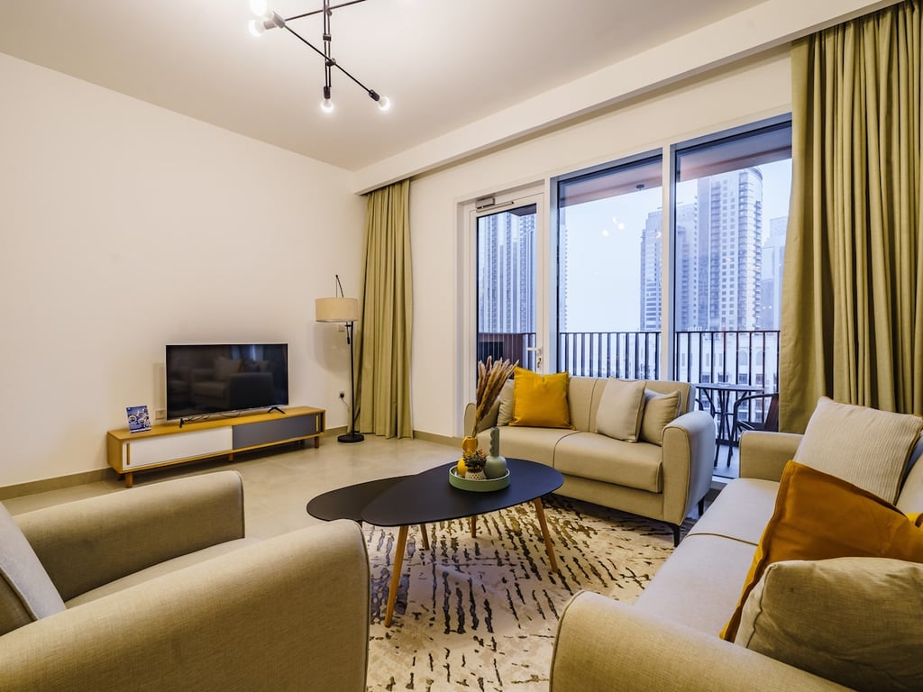 Living room with sofa set and balcony view