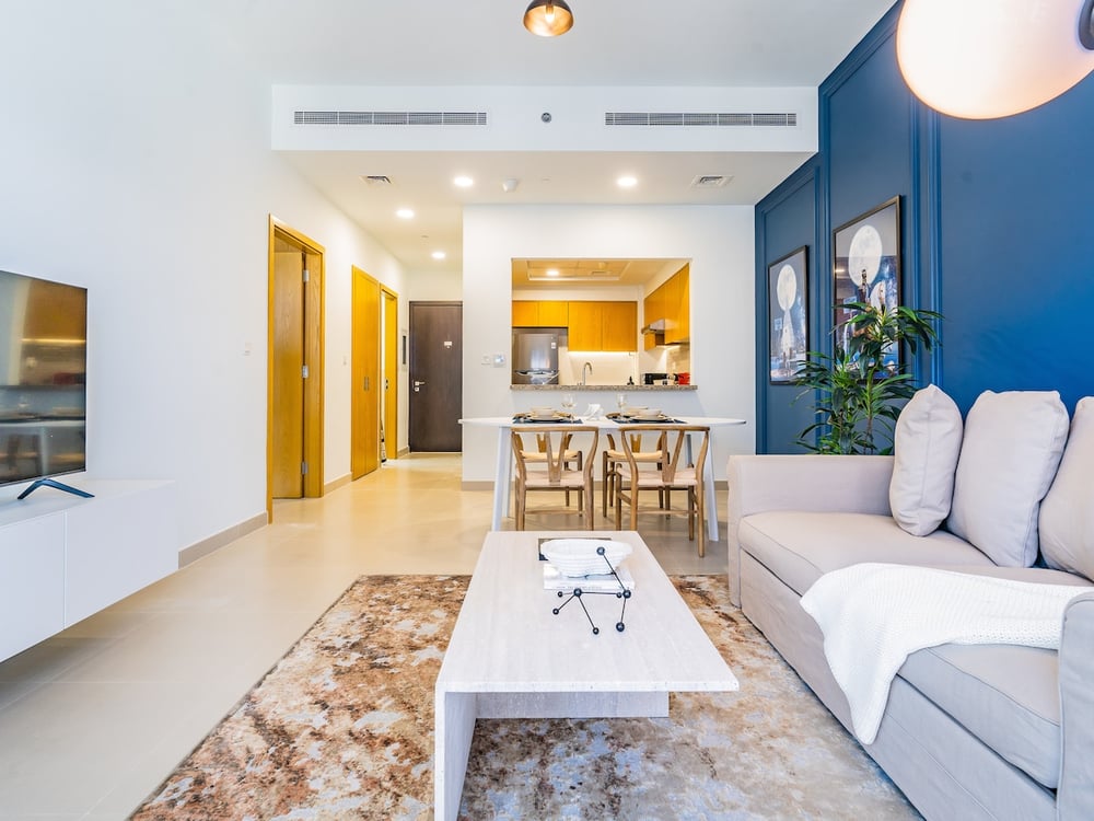 Open plan living room sofa TV and dining area