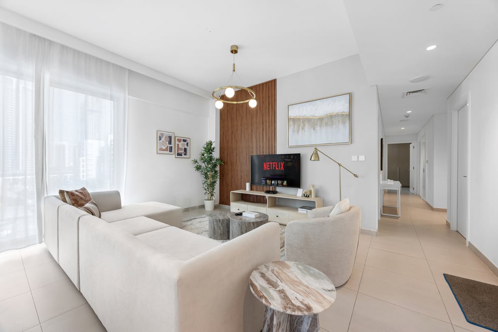 Living room with sofa TV and hallway view
