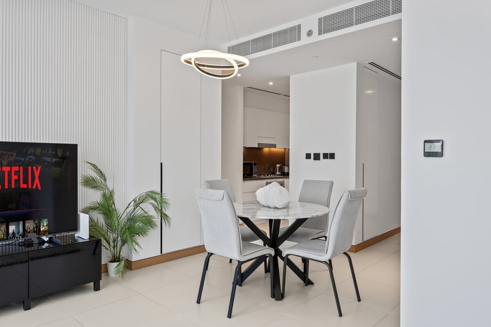 Dining area with round table and four chairs