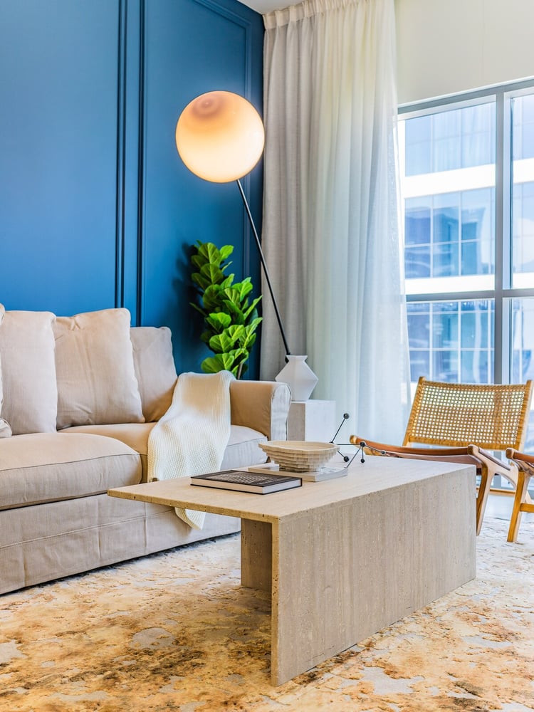 Living room blue wall sofa and coffee table