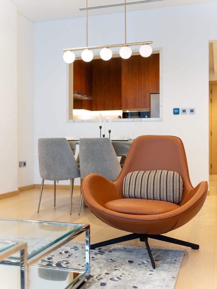 Armchair and glass coffee table in living area