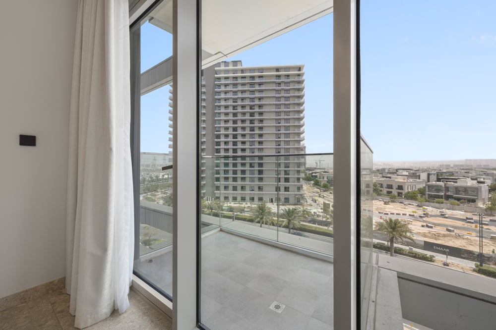 Floor-to-ceiling window view of building and surroundings