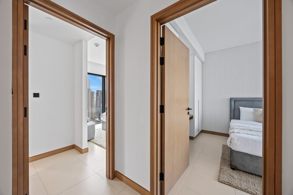 Hallway with two doors leading to bedrooms