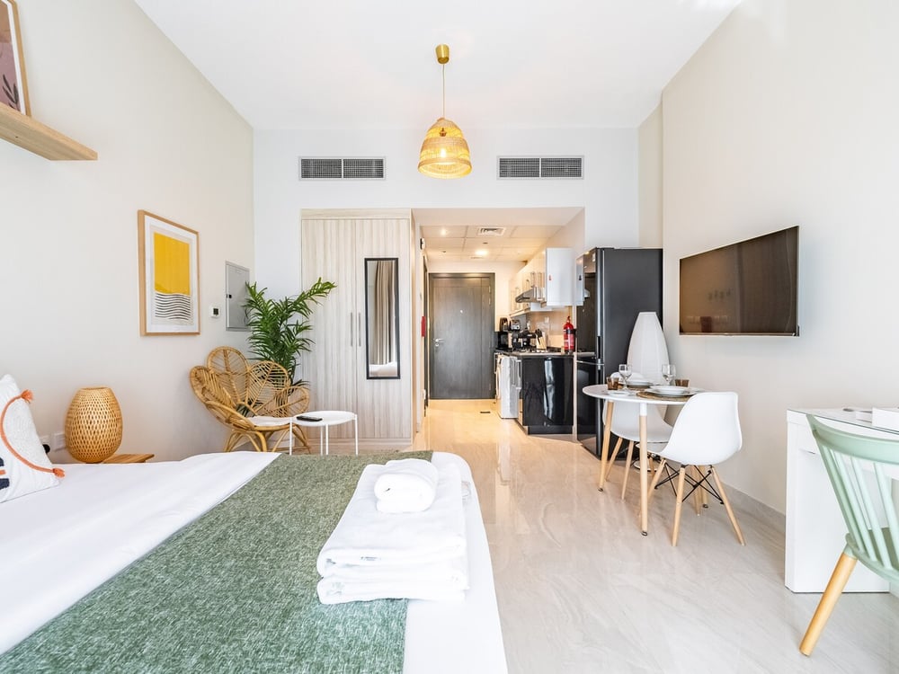 Studio open plan with double bed TV and dining area