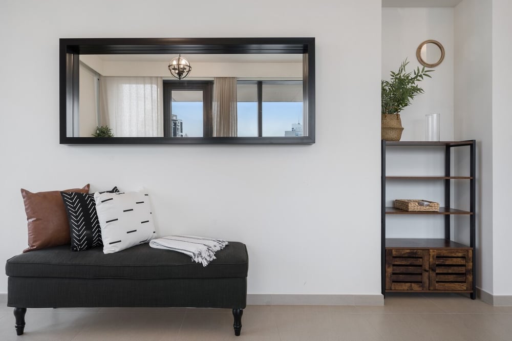 Bench with large mirror and shelving unit