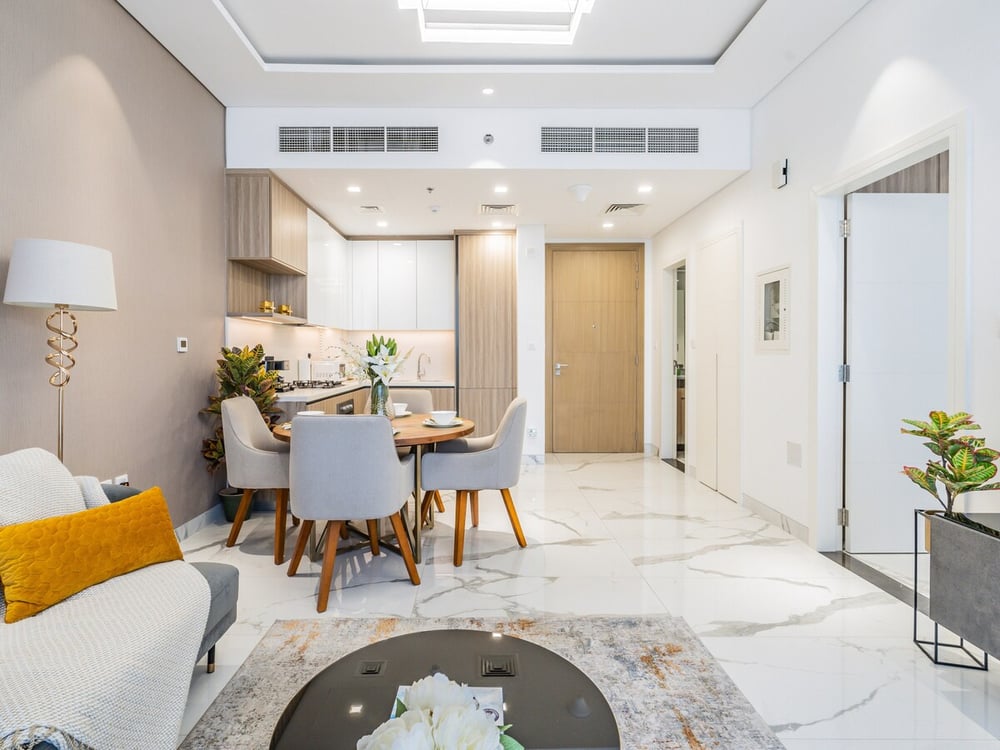 Open-plan living dining kitchen on marble floor