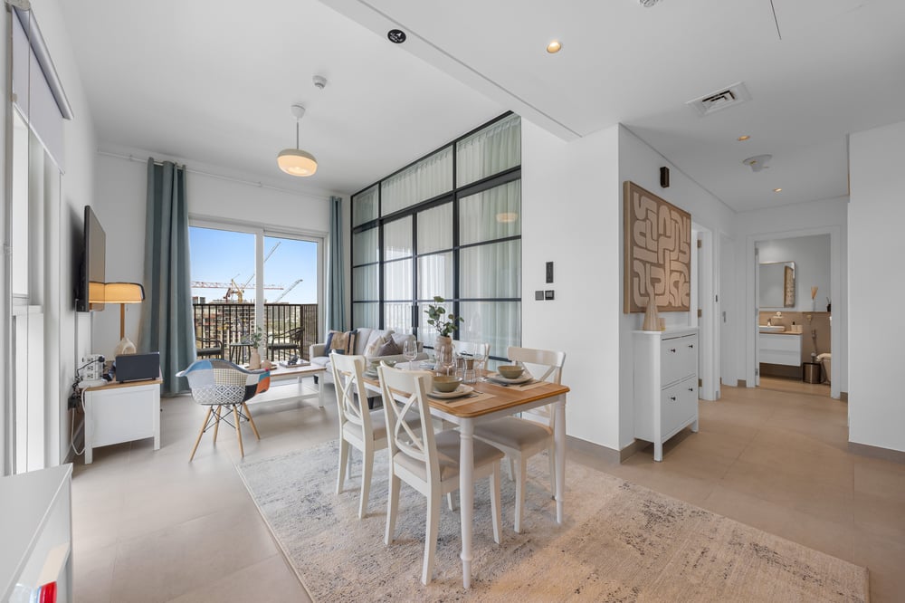 Open-plan living and dining area with glass partition