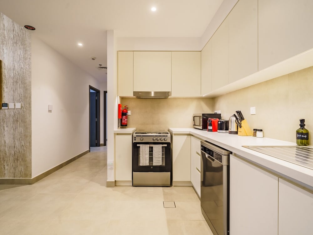 Kitchen with white cabinets and gas stove