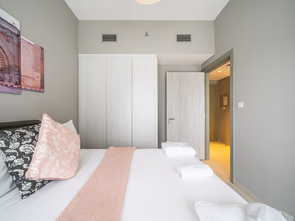 Bedroom with double bed wardrobe and room entrance