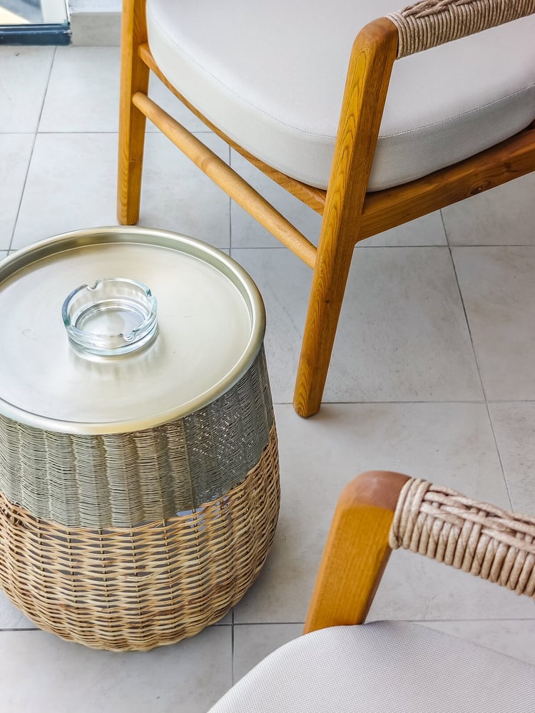 Close-up of wicker side table and chairs in living area