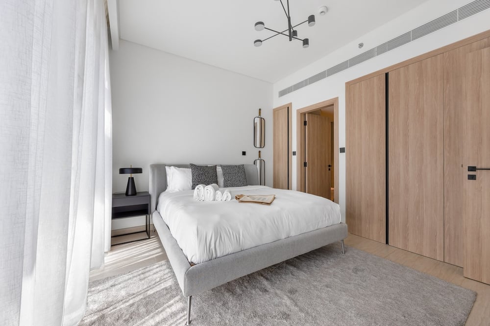 Bedroom with double bed, wardrobe and chandelier