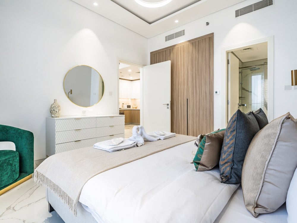 Bedroom with double bed dresser and wardrobe