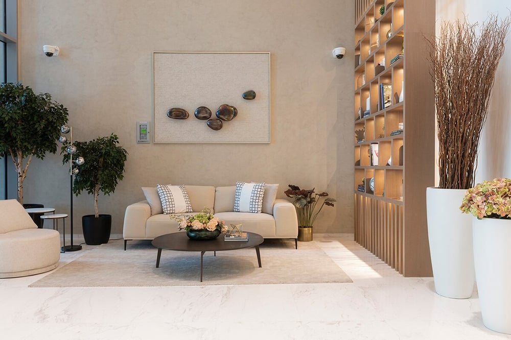 Building's common area with a sofa and a bookshelf