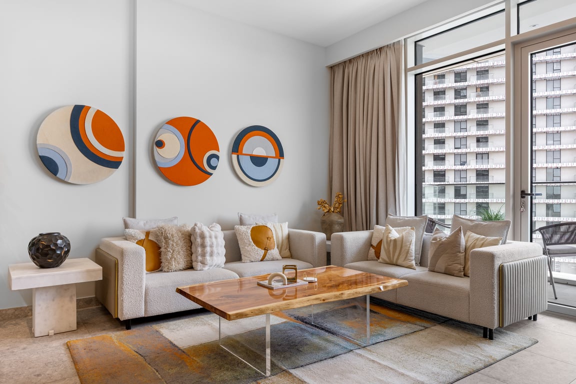 Living room with two sofas and colorful wall art