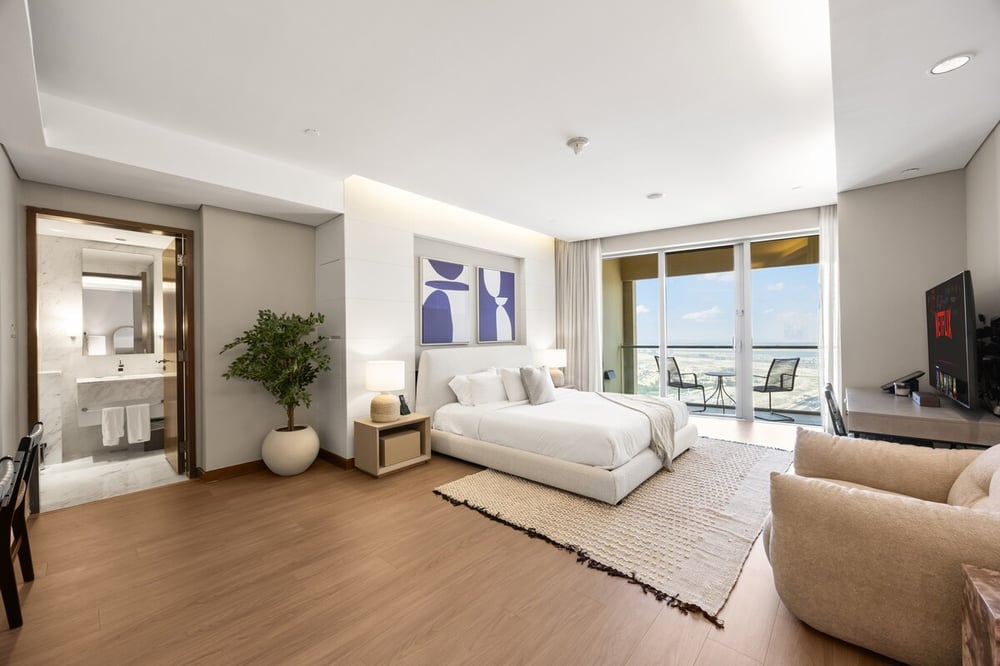 Studio with king bed, sofa, balcony access and sea view