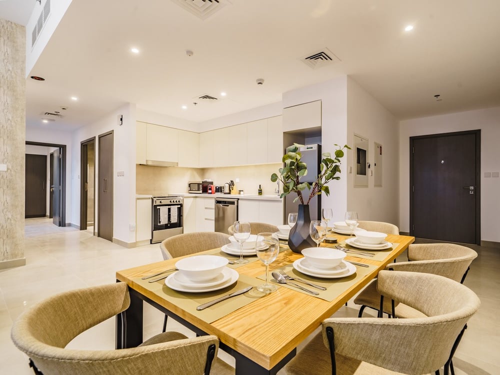 Dining area with kitchen visible in background