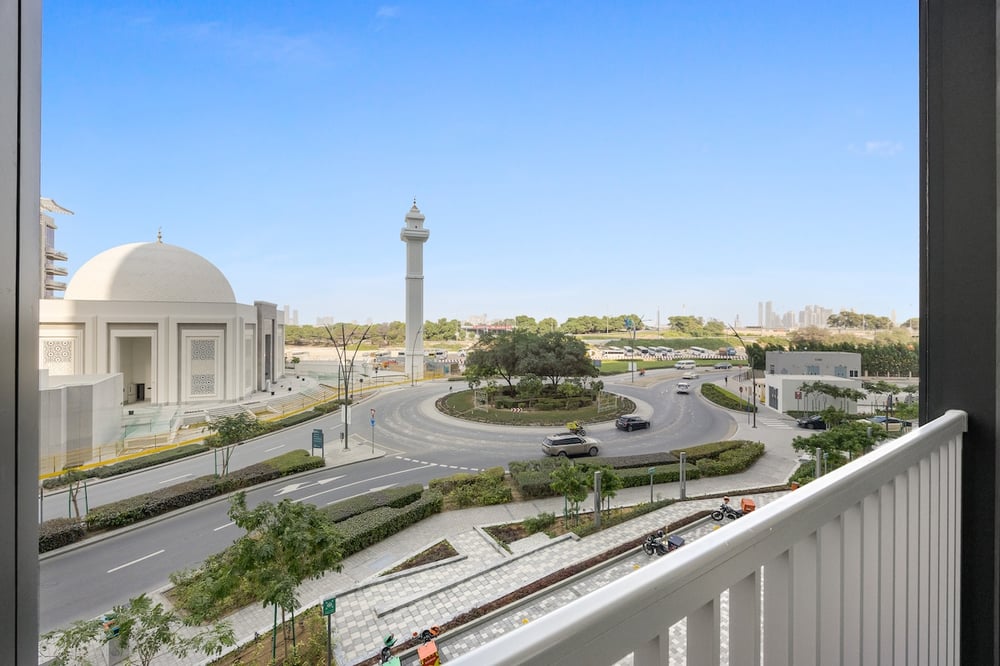 Balcony view over city roundabout and mosque dome