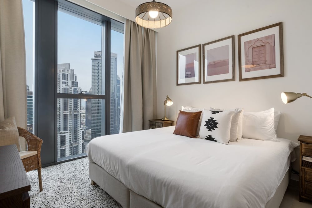 Second bedroom with king bed and city view