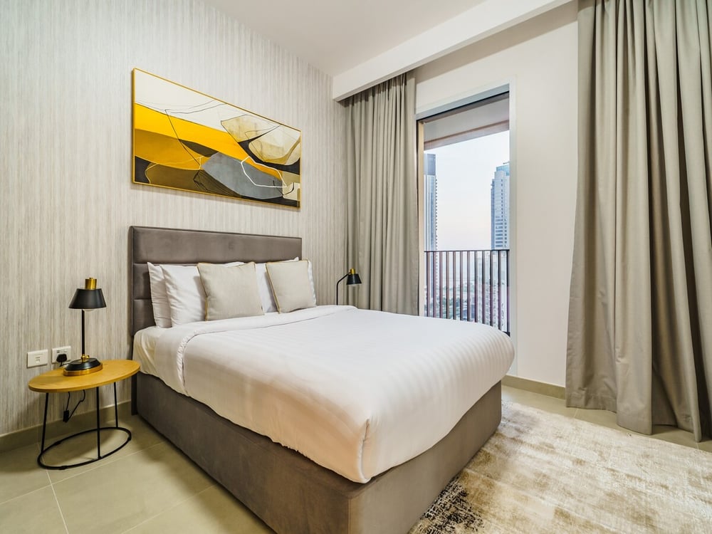 Second bedroom with a king bed and a balcony