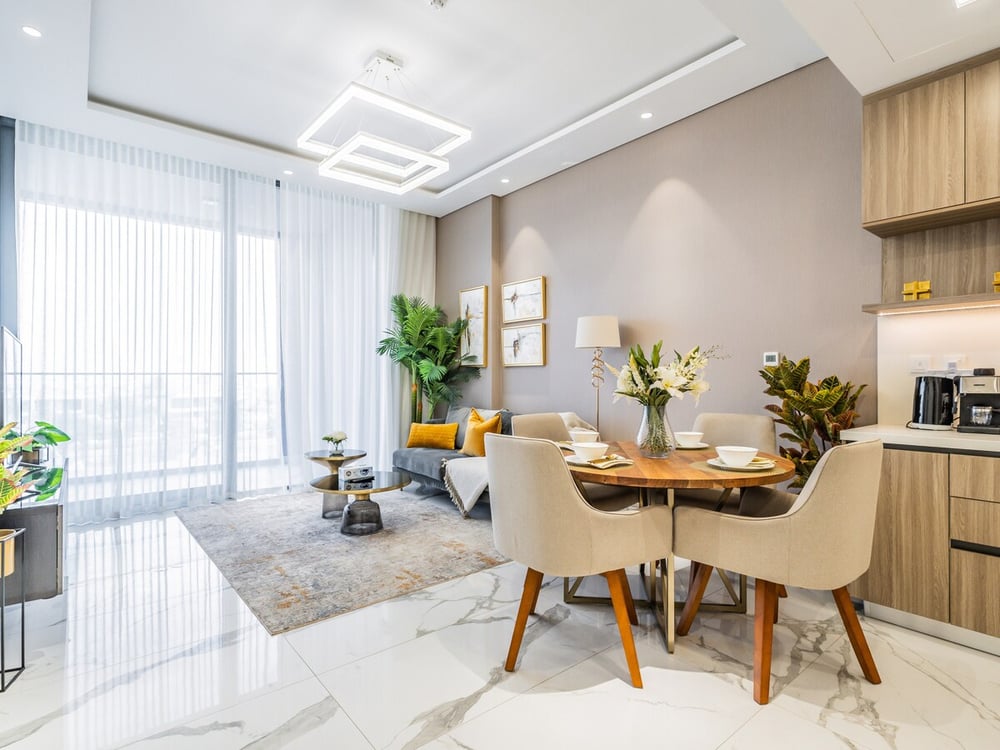 Dining table with chairs in open-plan living space