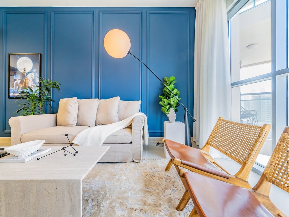 Living room blue wall sofa and work desk