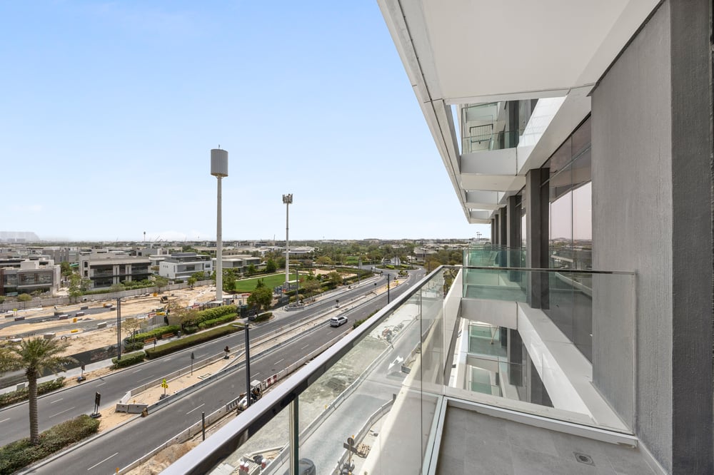 Balcony with glass railing and street view