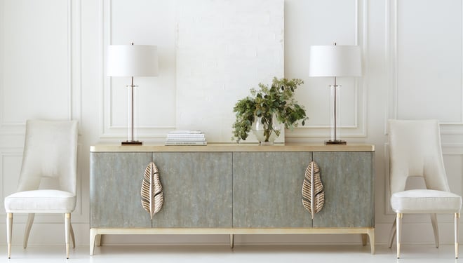 Caracole console table with oversized metal leaf hardware