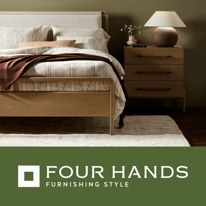 Four Hands image of bedroom featuring an upholstered bed next to a wood nightstand.