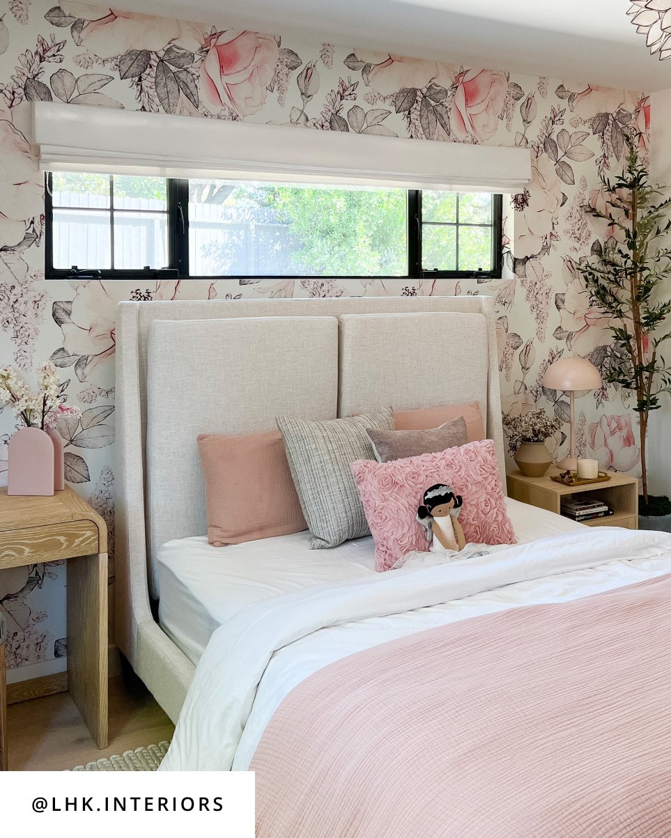 Design by @lhk_interiors, A cozy bedroom with beautiful floral wallpaper and a lovely touch of pink in the bedding.