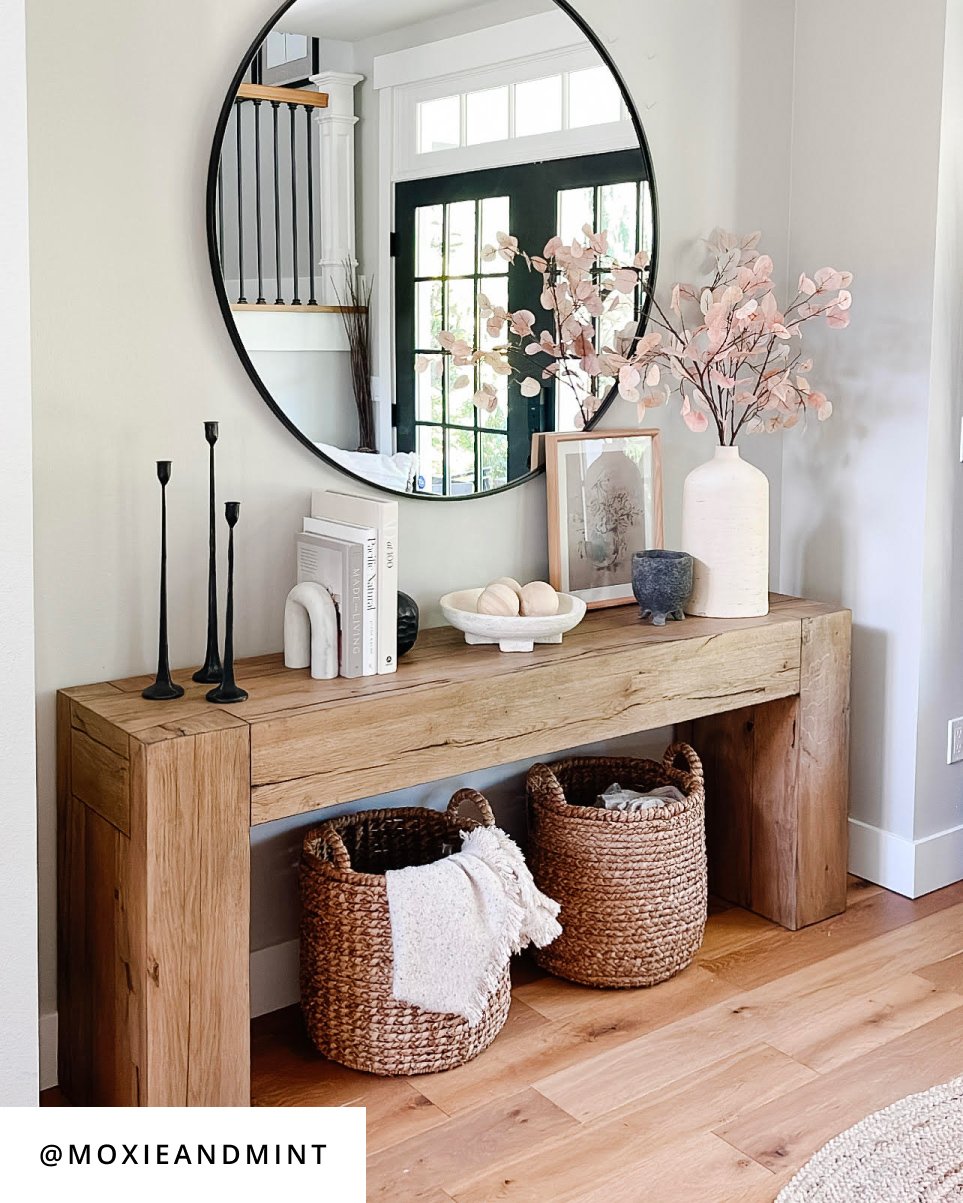 Design by @moxieandmint, A stylish wooden console table with baskets and a mirror, perfect for adding charm and functionality to any space.