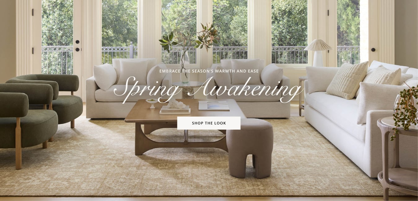 Bright spring living room with neutral sofas, textured rug, and natural wood accents