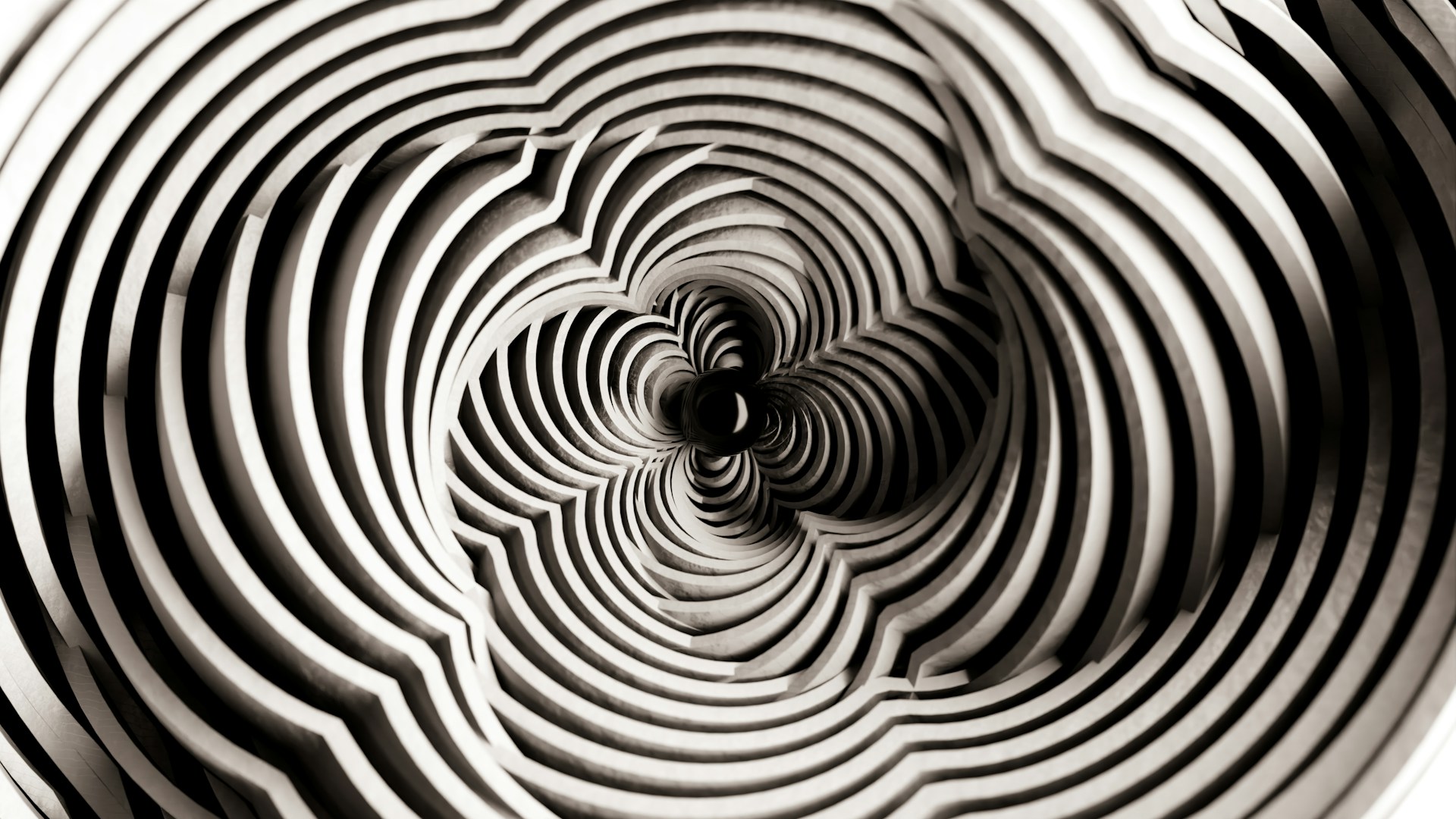 Concentric ridges spiraling inward toward a dark center