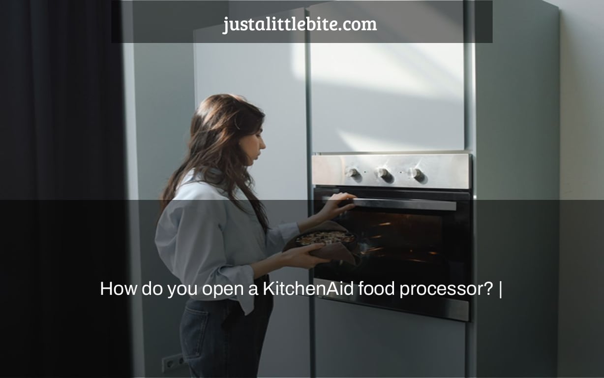 How do you open a KitchenAid food processor? |